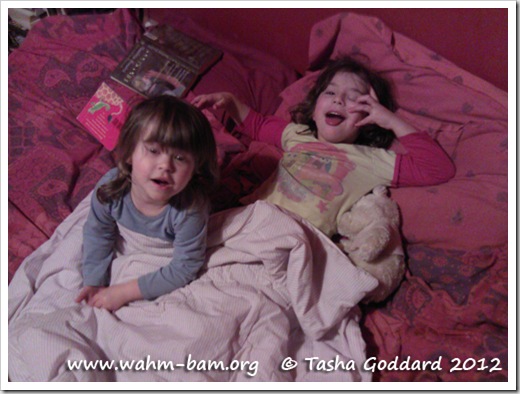 Snuggling up in bed telling stories (www.wahm-bam.org © Tasha Goddard 2012)